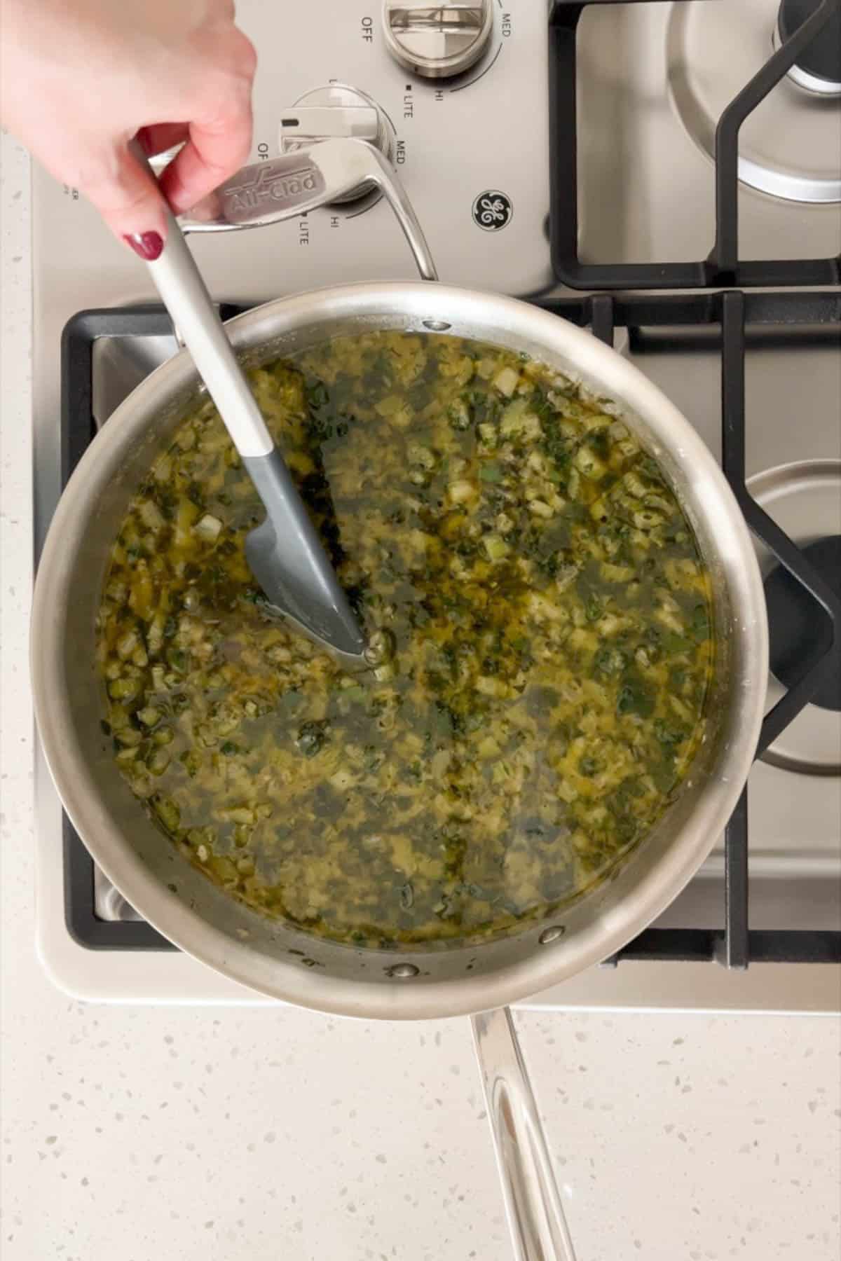 A saute pan with an herb butter sauce for the dressing.