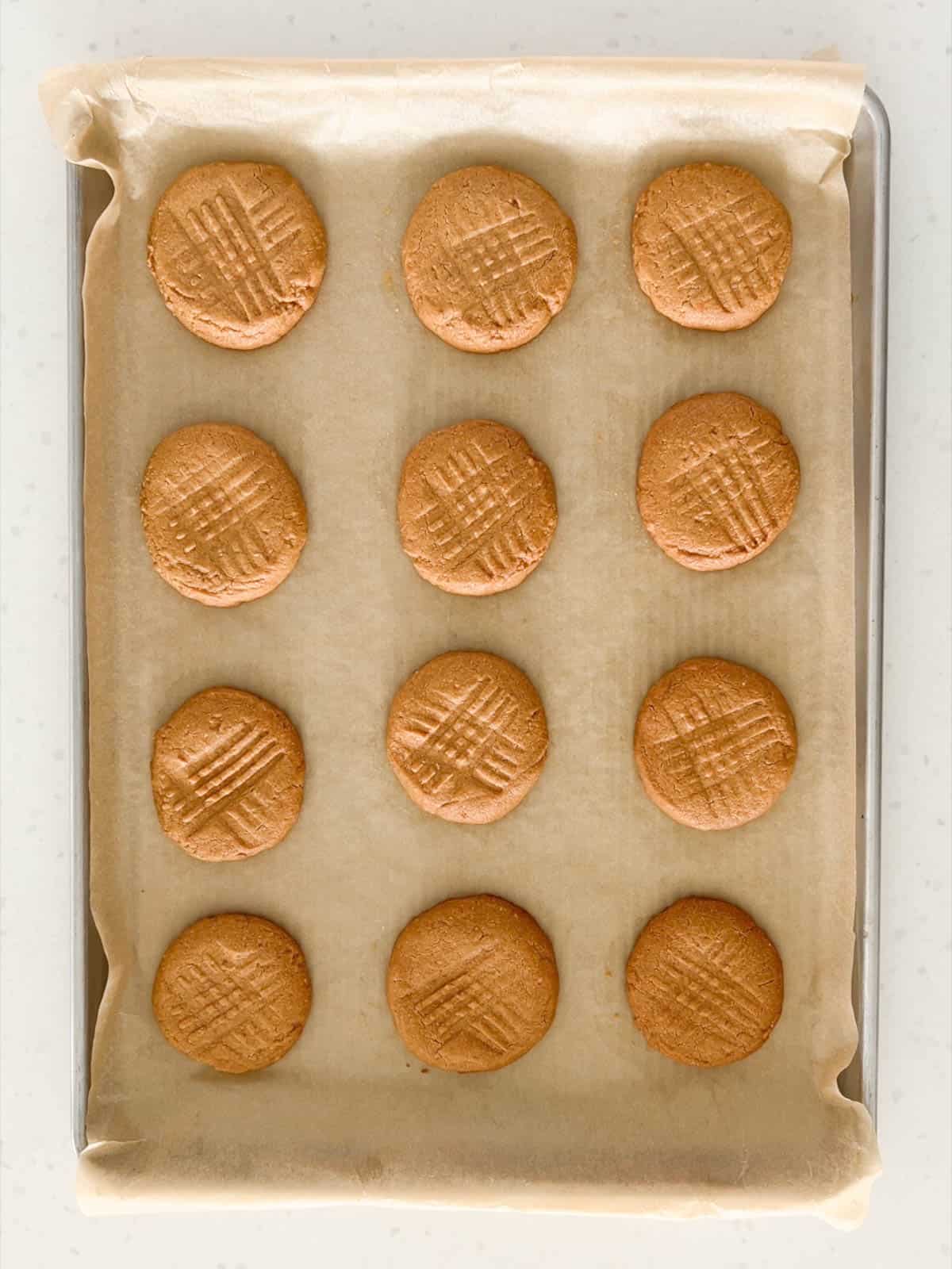 Peanut butter cookies are baked until the tops are dry and not shiny.
