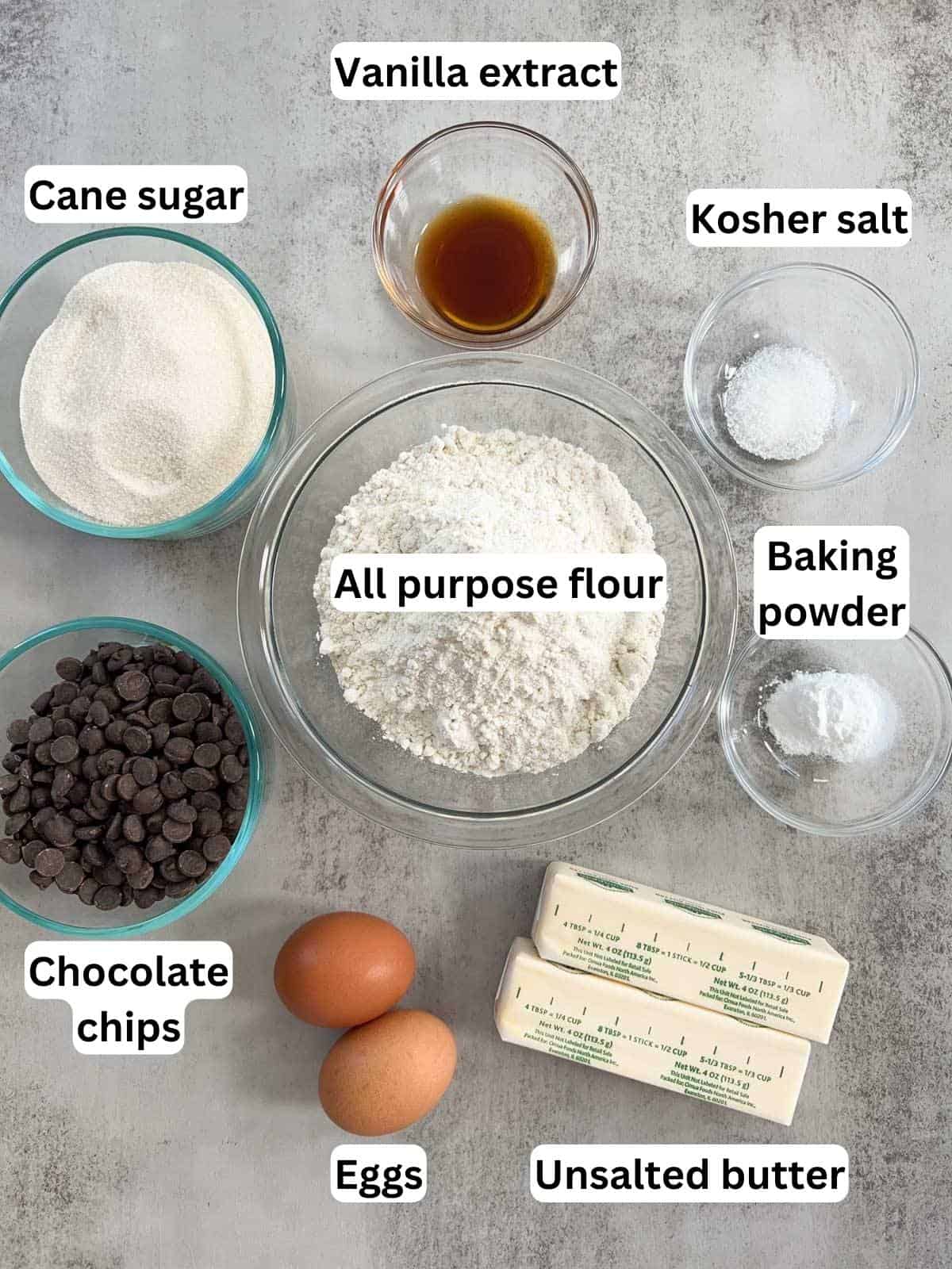The ingredients to make chocolate chip sugar cookies.
