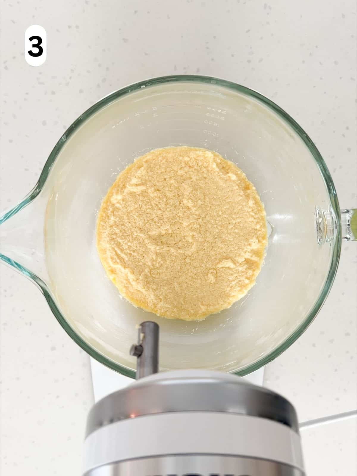 Butter, sugar, eggs, almond extract, and vanilla extract are mixed together until combined.