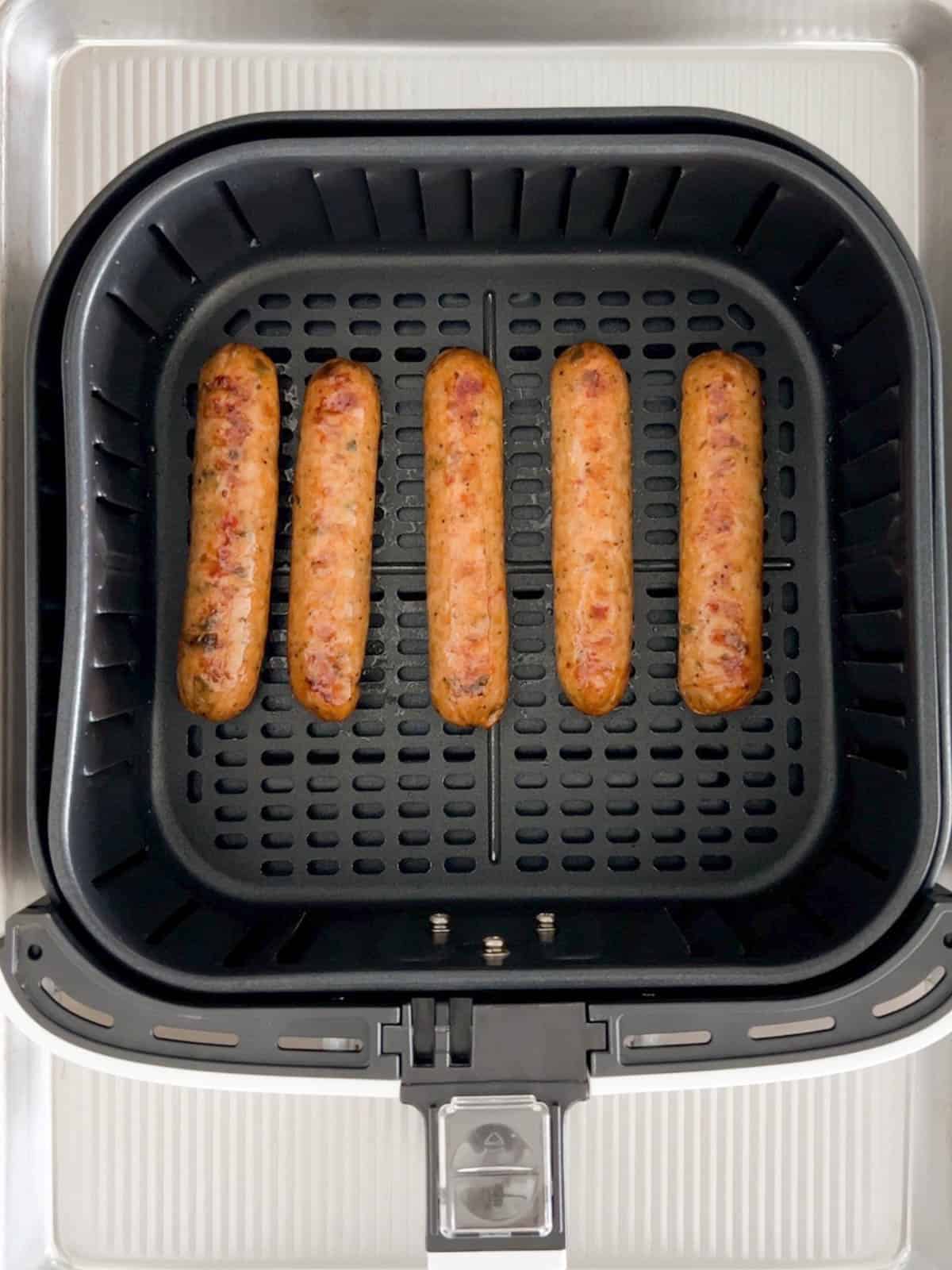 The sausages are air fried until lightly crisp on the outside.