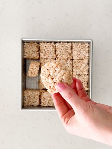 The rice crispy treats are cut into bars before serving.