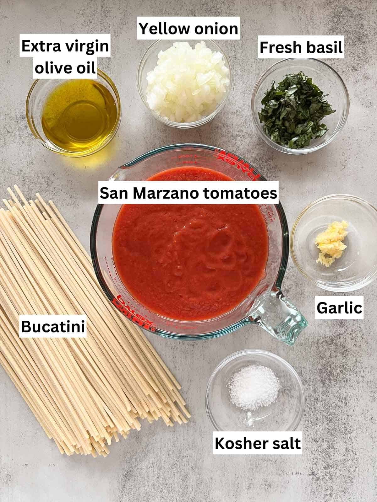 The ingredients to make bucatini pomodoro.
