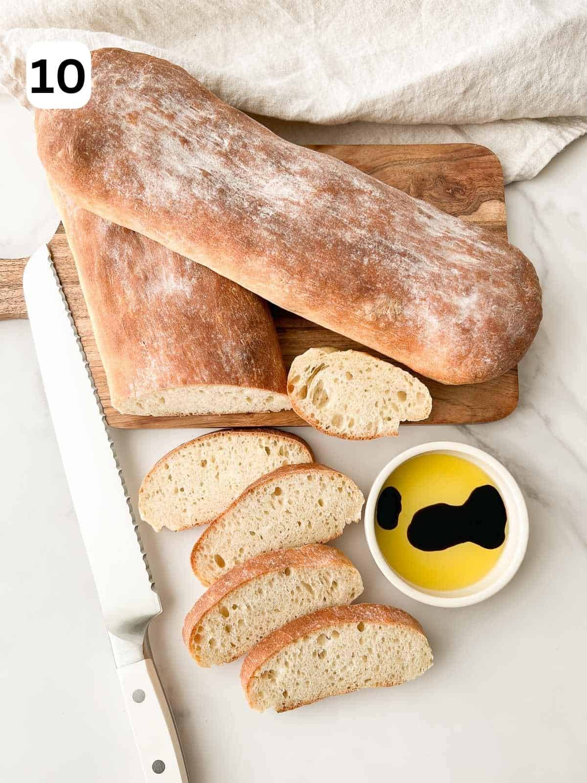 The bread is sliced and served.