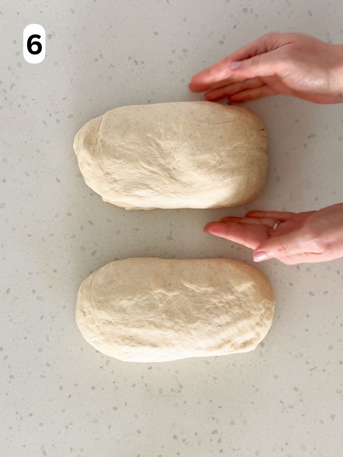 The dough is shaped into two, equal sized loaves.