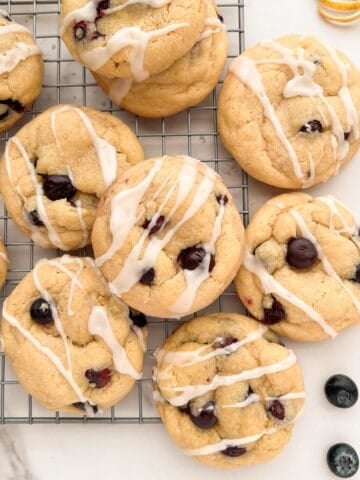 Lemon blueberry cookies on a cooling rack.