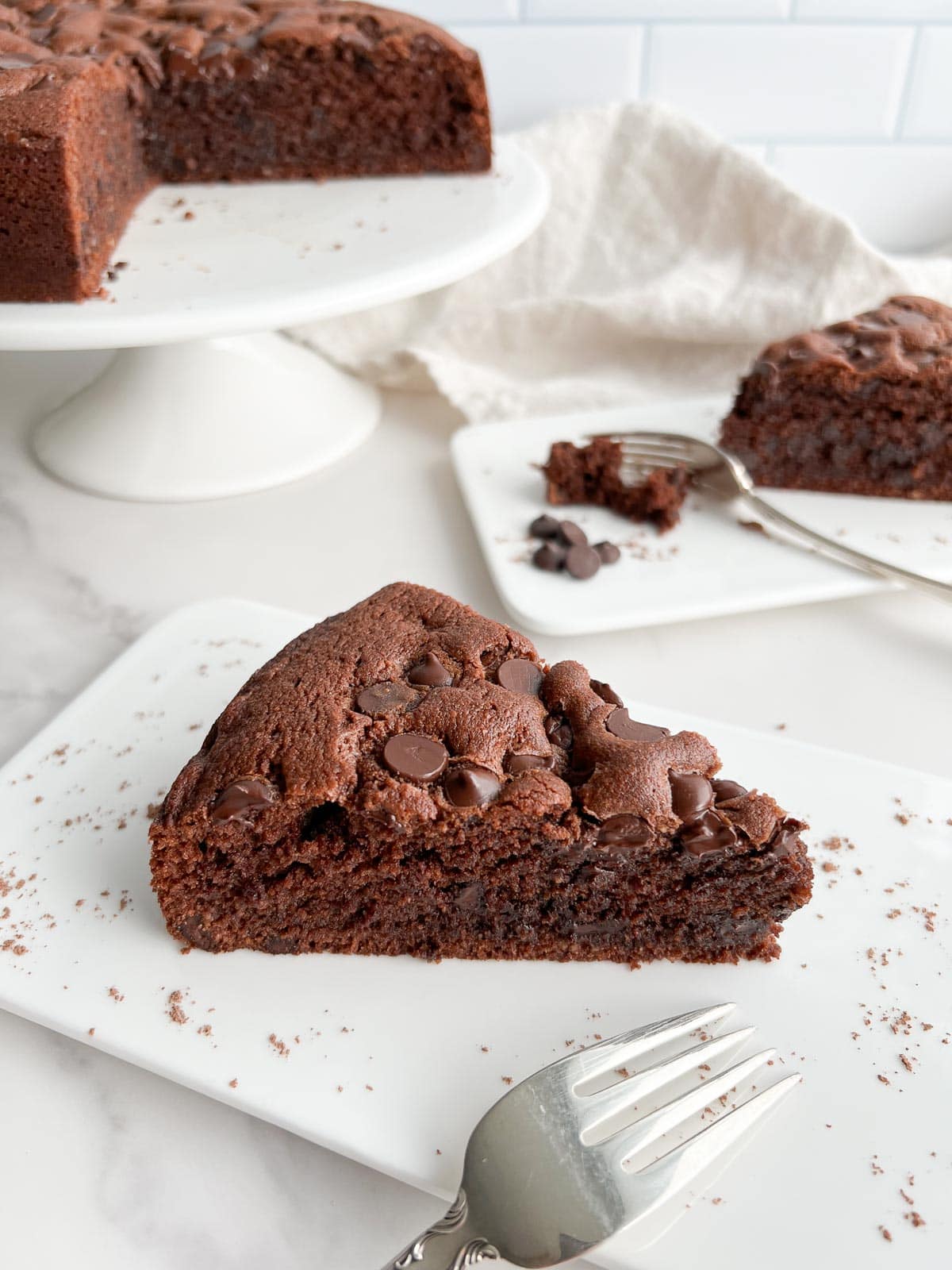 A slice of chocolate ricotta cake on a plate.