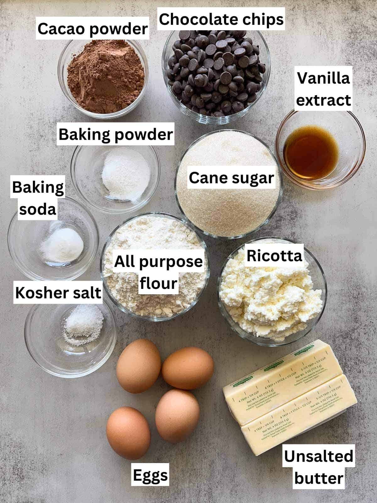 The ingredients to make chocolate ricotta cake.