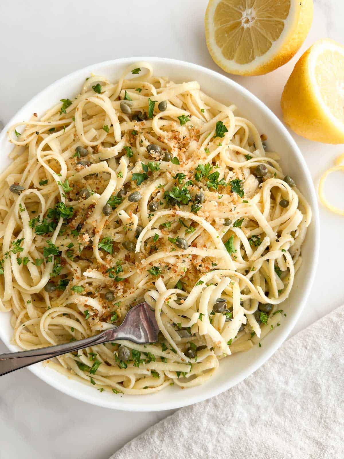 A bowl of lemon caper pasta.