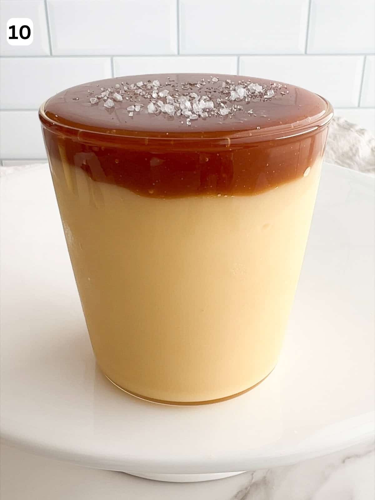 The budino is garnished with salted caramel sauce and sea salt.