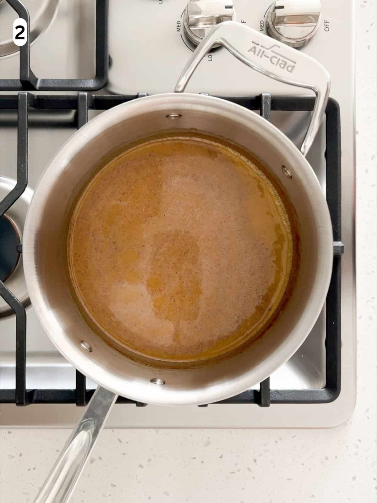 The panna cotta base is heated until small bubbles form along the edges.