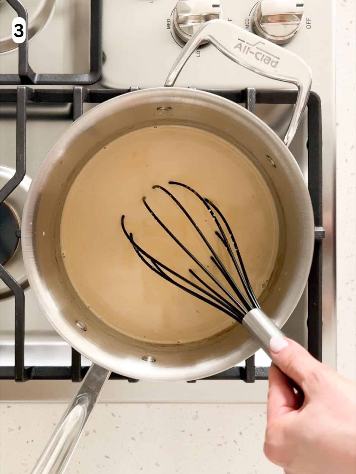 The gelatin and heavy cream are whisked into the panna cotta base until combined.