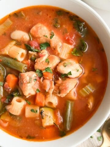 A bowl of chicken minestrone soup.