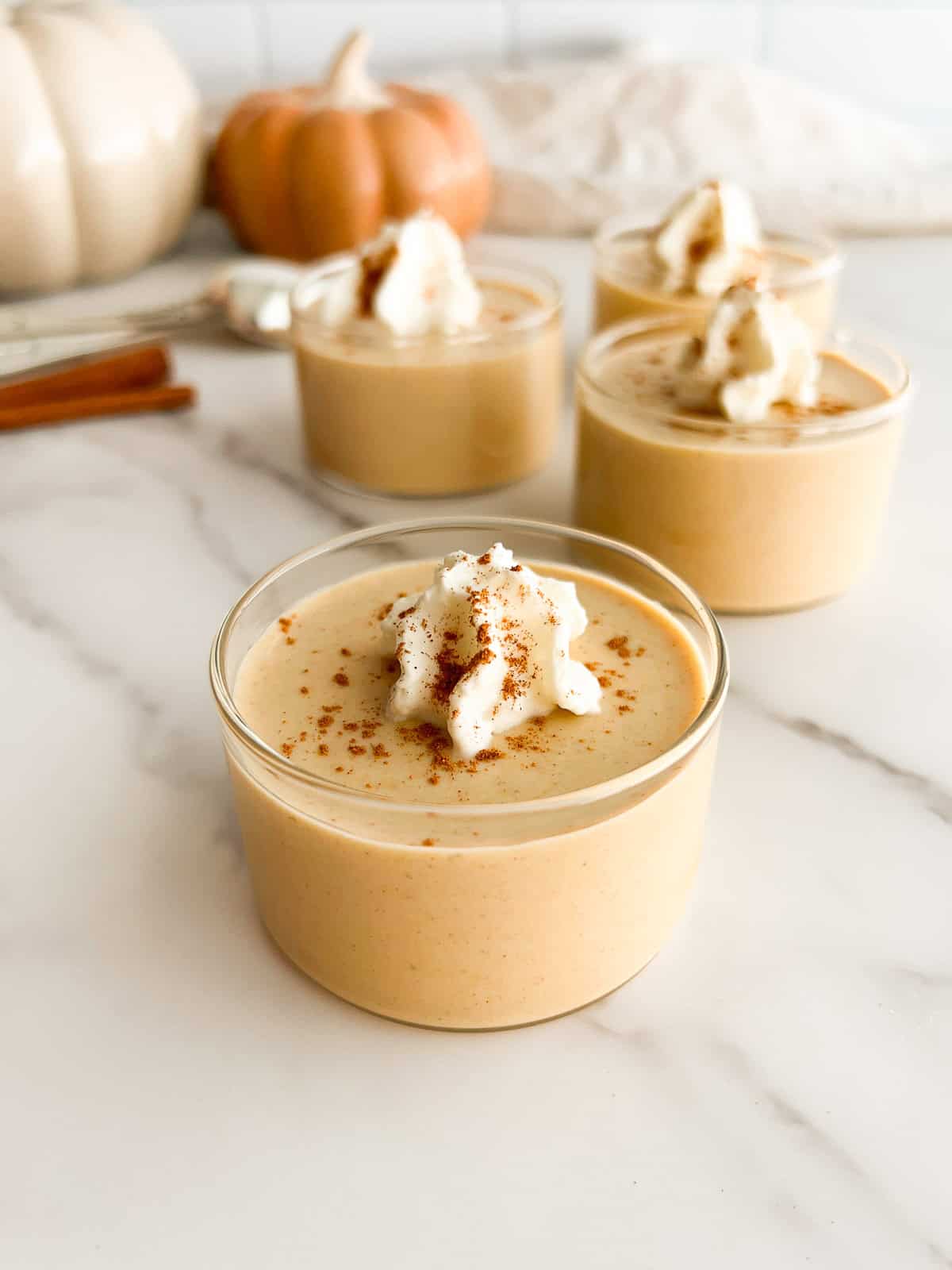 Pumpkin panna cotta in serving glasses.