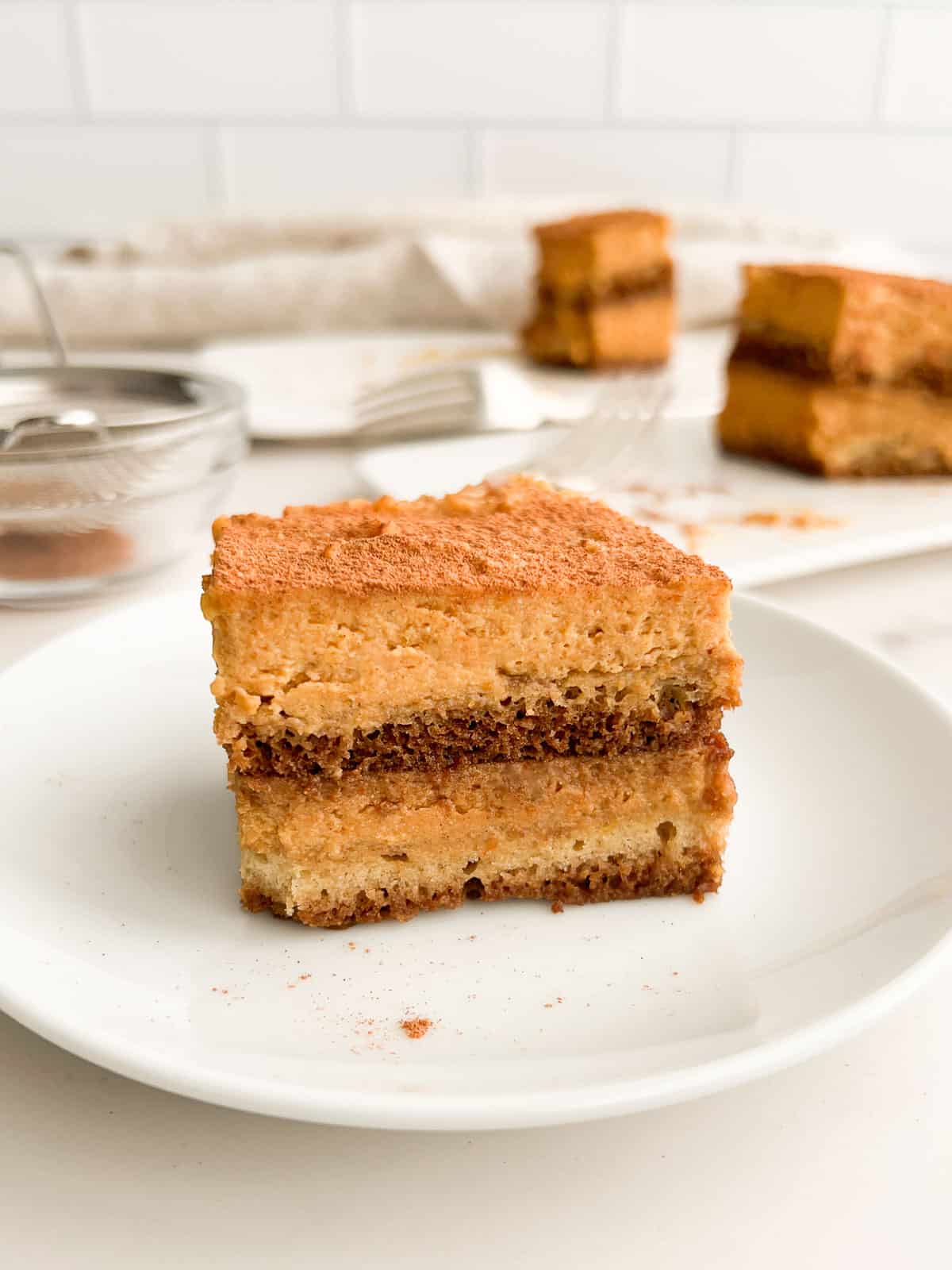 Pumpkin tiramisu on a serving plate.