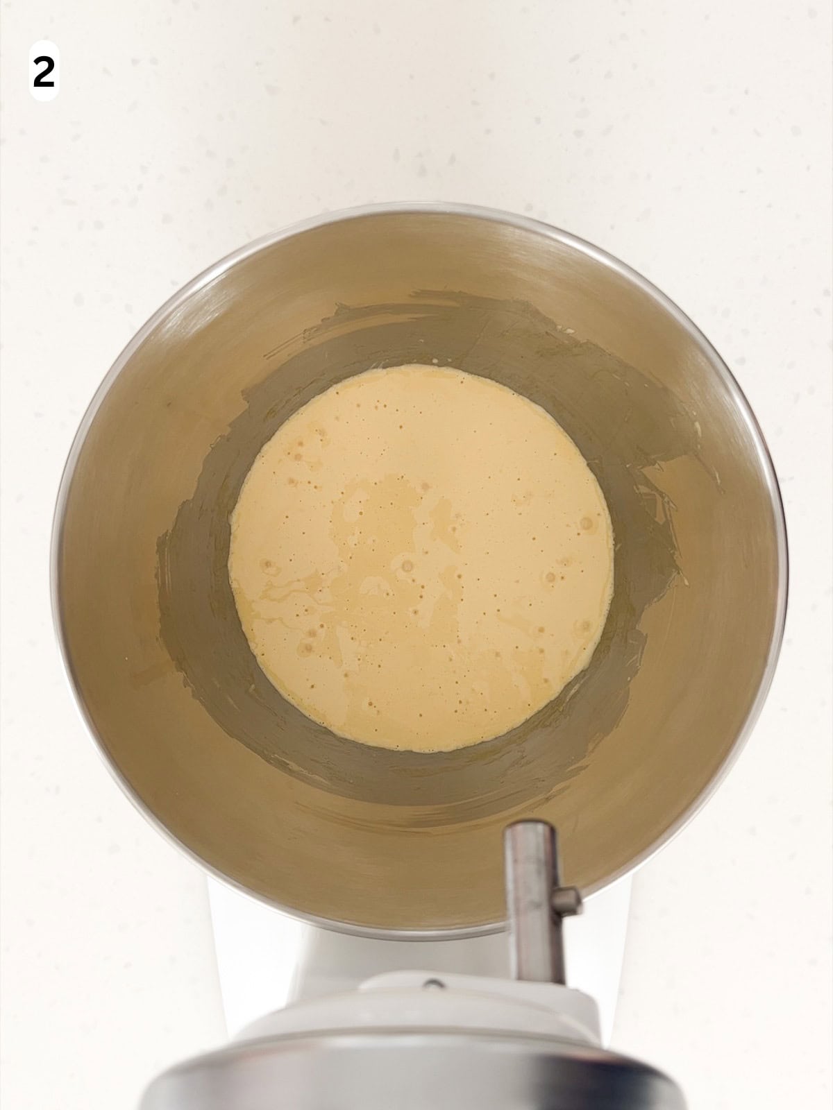 Egg yolks, sugar, vanilla, and salt are whisked until pale and fluffy.