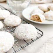 Italian wedding cookies on a cooling rack.