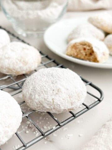 Italian wedding cookies on a cooling rack.