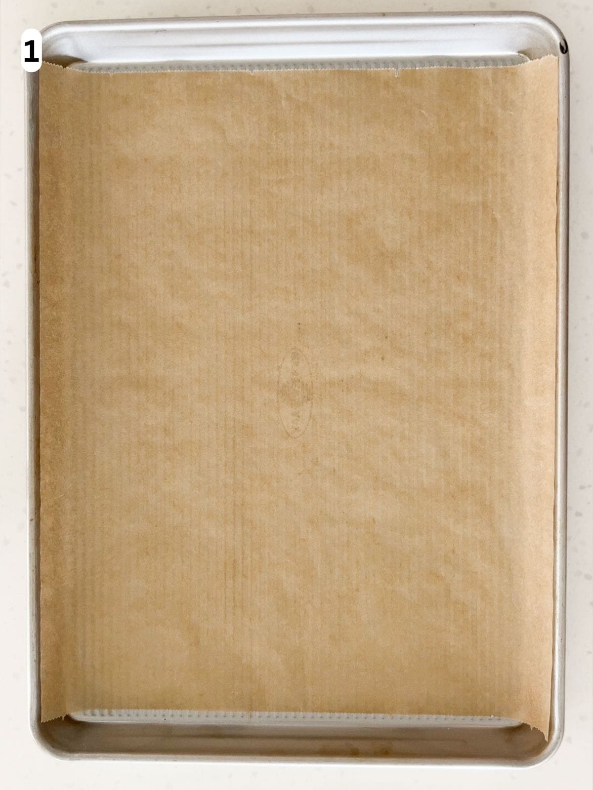 A baking sheet lined with parchment paper.