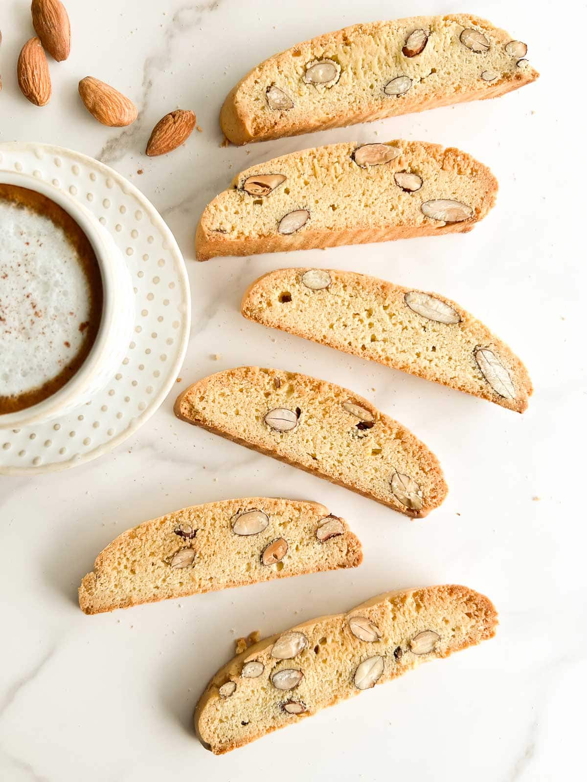 Almond biscotti (cantucci) with a latte to the side.