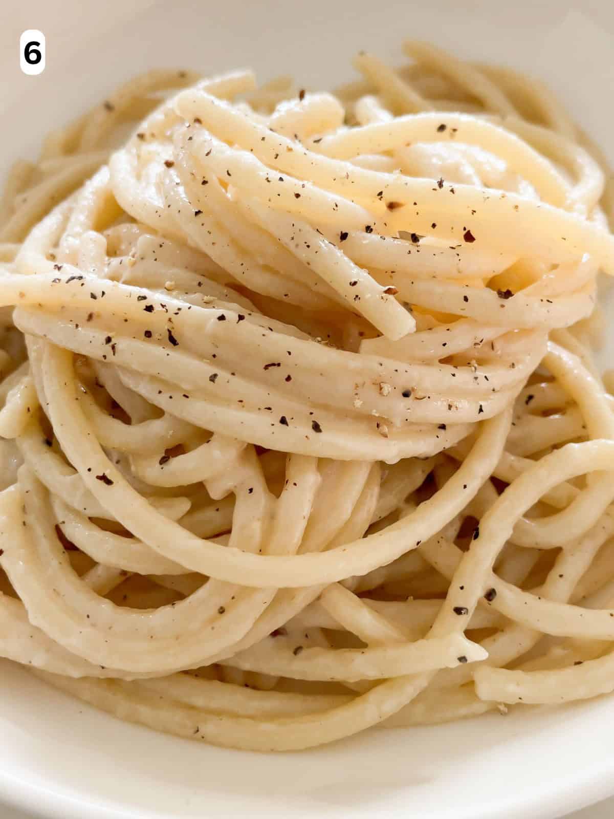 Cacio e pepe served on a plate.