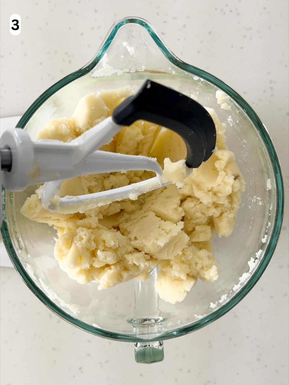 The potatoes are mashed with a stand mixer until no visible lumps remain.