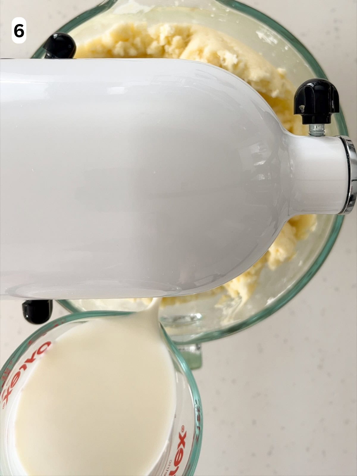 Milk is added to the mashed potatoes until they are creamy.