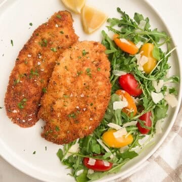 Chicken Milanese with an arugula salad to the side.
