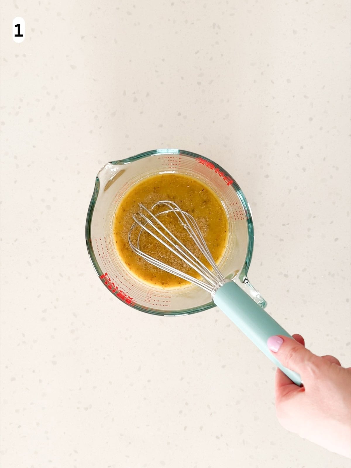The Italian red wine vinaigrette is whisked until combined.