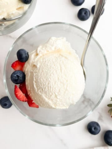 A scoop of no egg vanilla ice cream in a bowl.