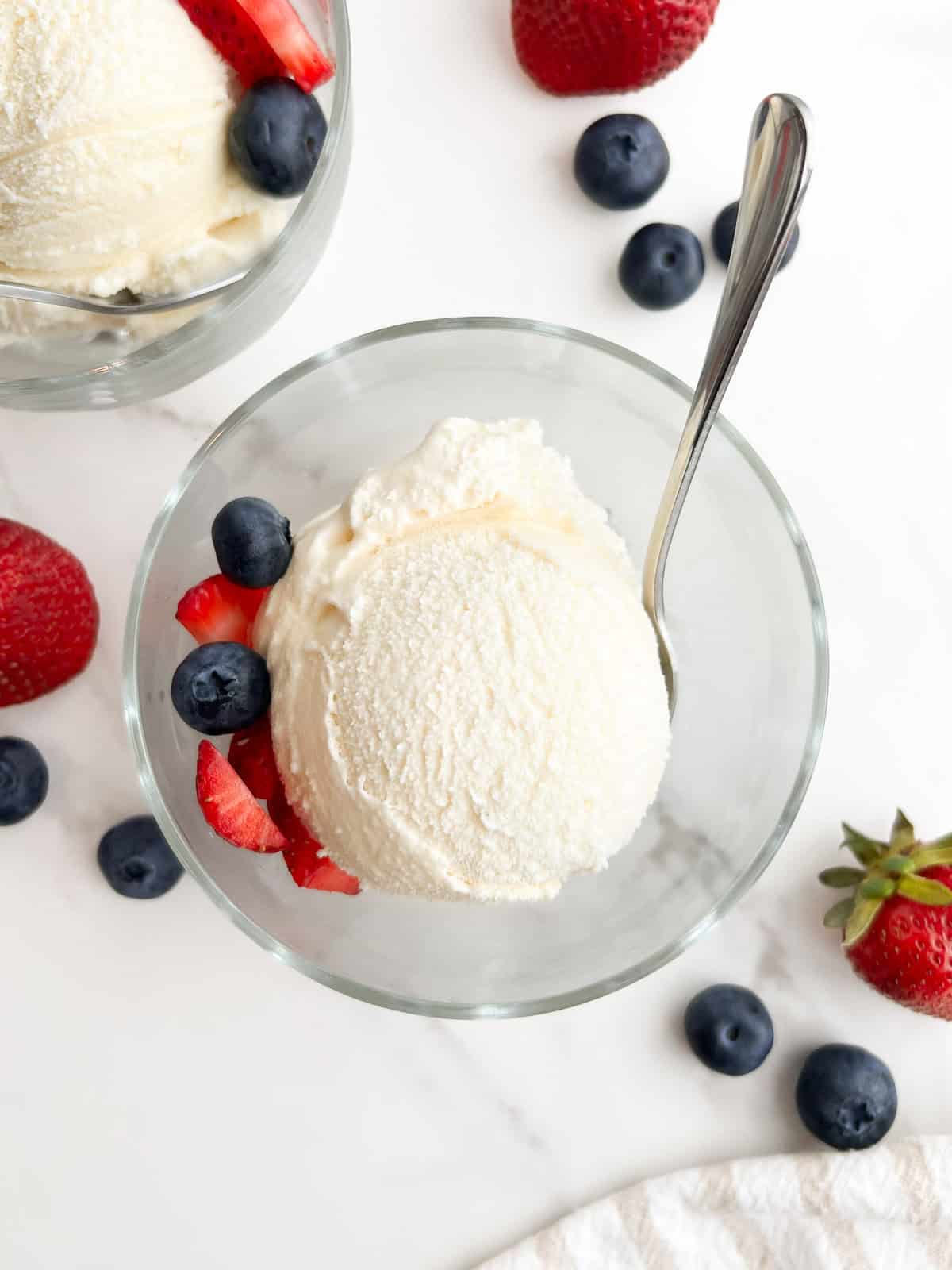 A scoop of no egg vanilla ice cream in a bowl.