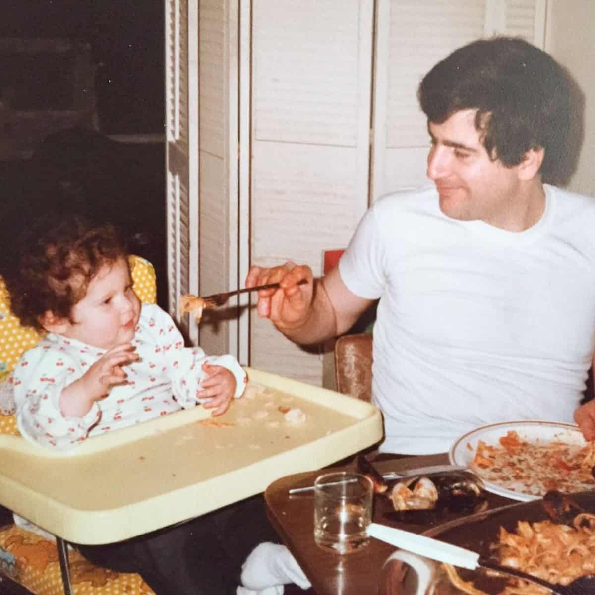 My dad feeding me pasta with mussels when I was about one year old.