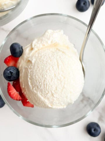 A scoop of no egg vanilla ice cream in a bowl.